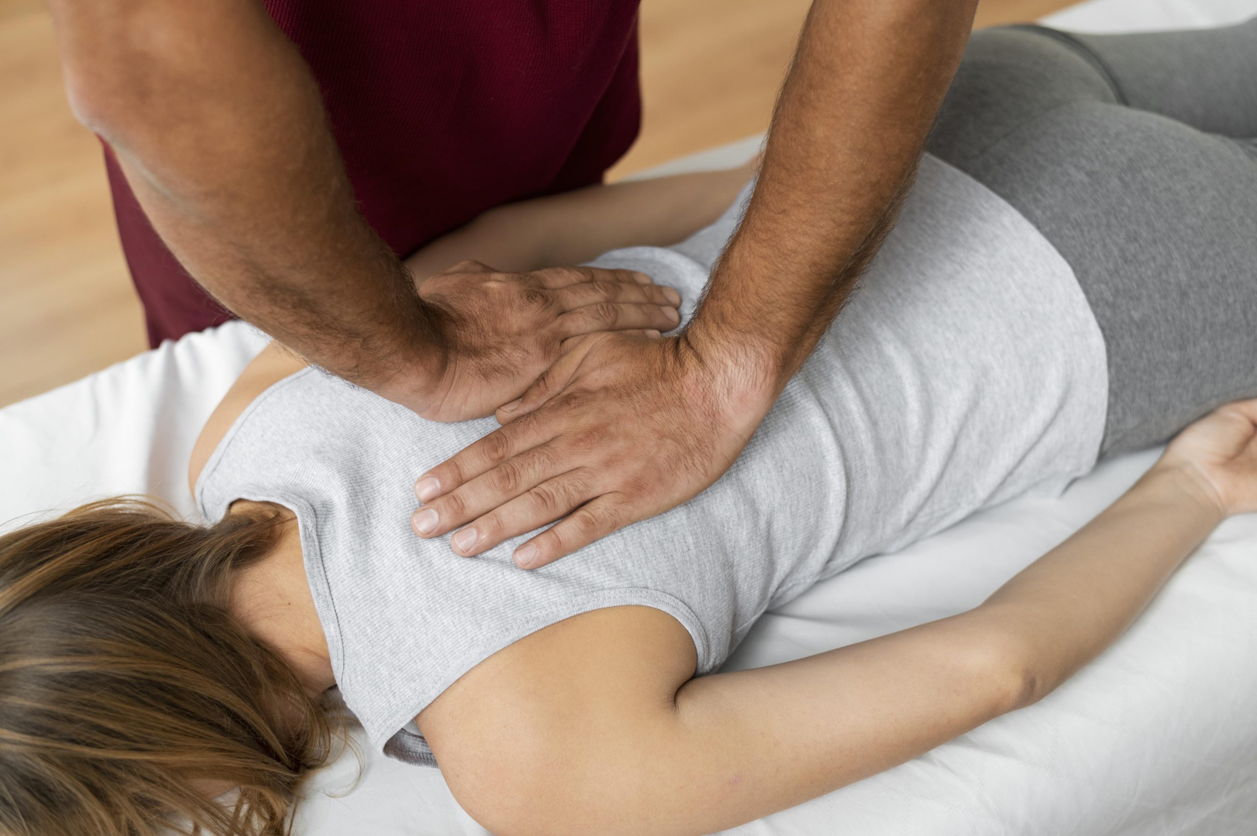 Manual therapy for sciatica being performed.